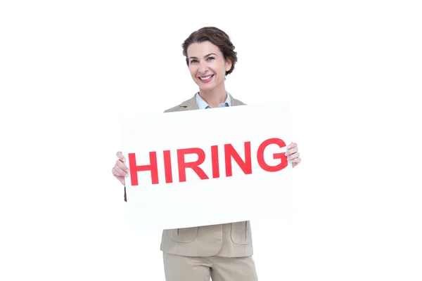 Businesswoman holding a hiring sign — Stock Photo, Image