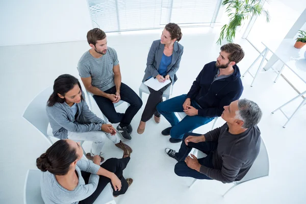 Group therapy in session sitting in a circle — Stock Photo, Image