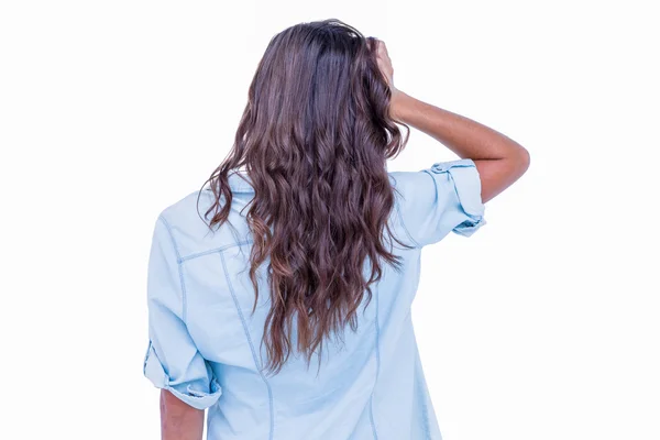 Rear view of pretty brunette with hand on head — Stock Photo, Image