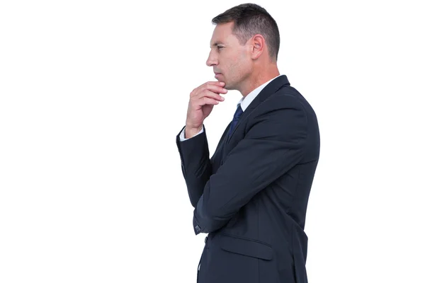 Businessman thinking with hand on chin — Stock Photo, Image