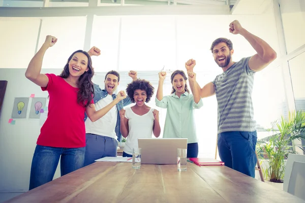 Happy business team with fists in the air — Stock Photo, Image