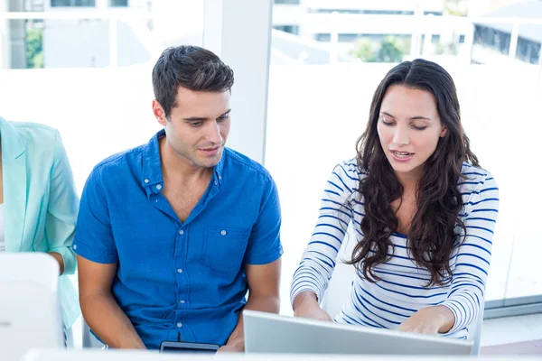 Creative business team using laptop in meeting — Stock Photo, Image