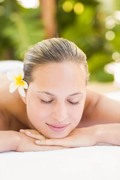 Blonde lying on towel at spa — Stock Photo, Image