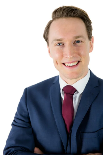 Happy businessman looking at camera with arms crossed — Stok fotoğraf