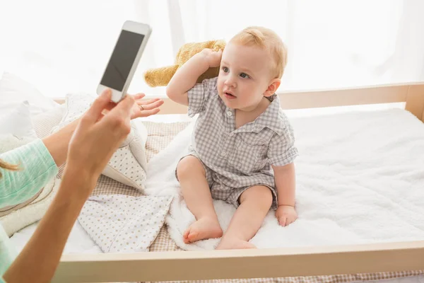 Mother taking picture of baby boy — Stock Photo, Image