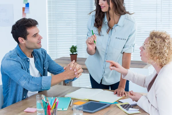 Attentive creative business people in meeting — Stock Photo, Image