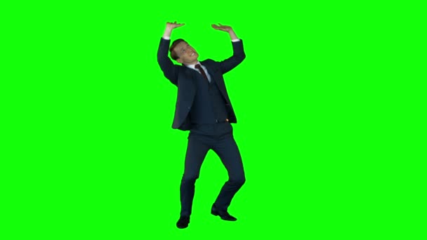 Businessman lifting something on green screen — Stock Video