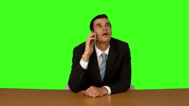 Businessman talking on the phone at his desk — Stock Video