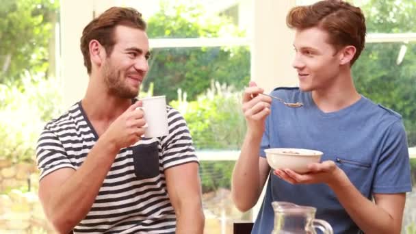 Happy homosexual taking breakfast — Stock Video