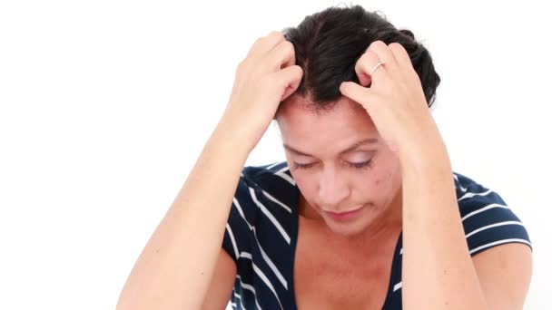 Sad woman sitting with head in hands — Stock Video