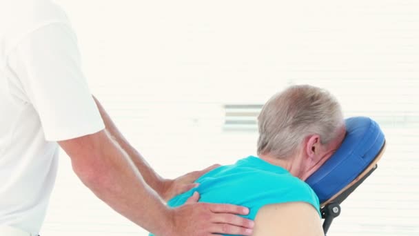 Physiotherapist doing back massage to his patient — Stock Video