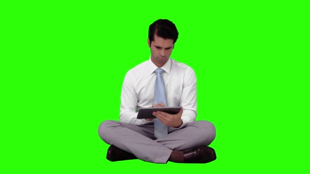 Businessman using his tablet pc — Stock Video