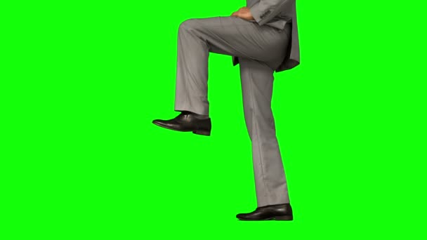 Businessman stepping on green screen — Stock Video