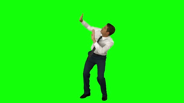 Businessman standing with arms raised — Stock Video