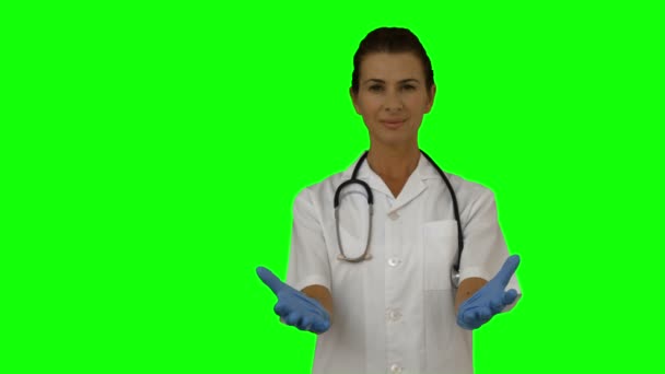 Female doctor presenting with hands — Stock Video