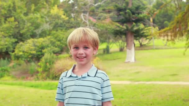 Happy little boy looking at camera — Stock Video