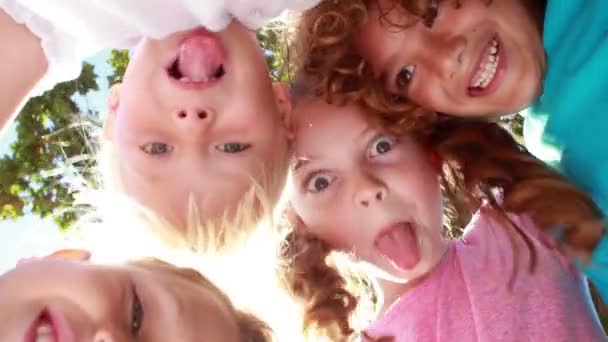 Happy children grimacing in front of camera — Stock Video