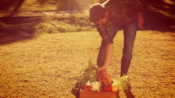 Handsome man holding carrot — Stock Video