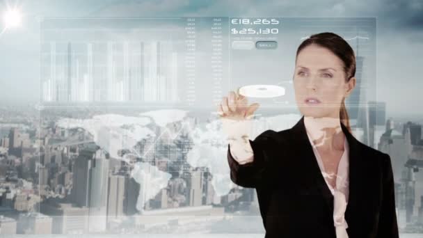 Businesswoman touching futuristic interface with city — Stock Video