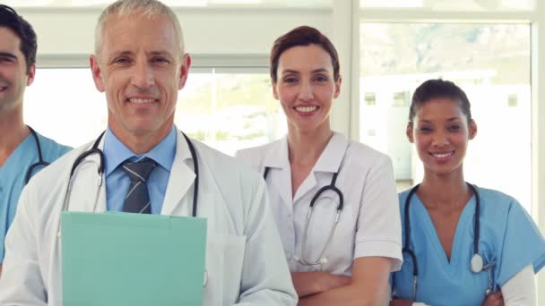 Team of smiling doctors looking at camera — Stock Video