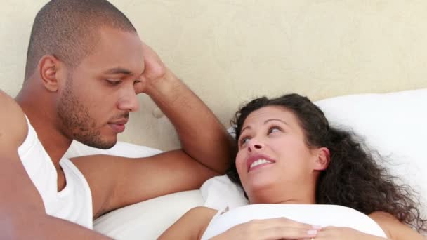 Young couple discussing together on the bed — Stock Video