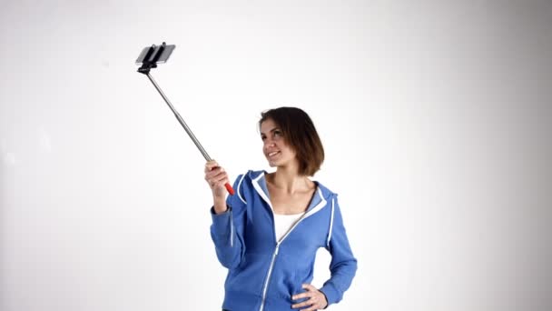 Pretty girl taking selfie with stick — Stock Video