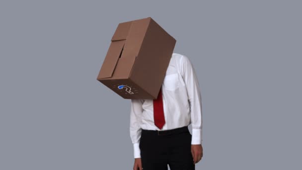 Businessman looking down with box on head — Stock Video