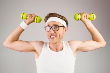 hipster in sportswear with dumbbells clipart