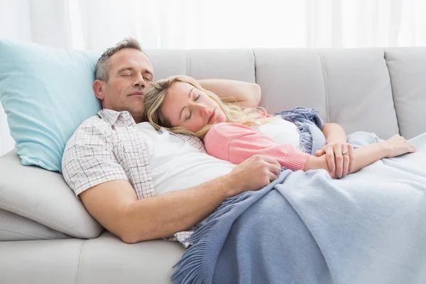 Couple napping under blanket — Stock Photo, Image