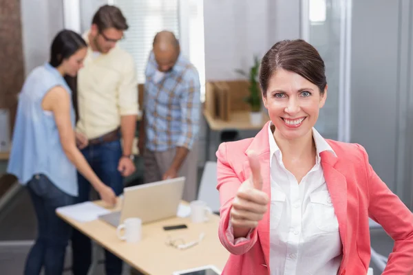 Businesswoman giving thumbs up — Stock Photo, Image