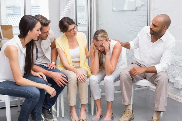 Business team supporting sad colleague — Stock Photo, Image