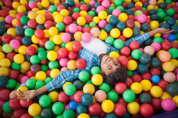 Boy in ball pool — Stock Photo, Image