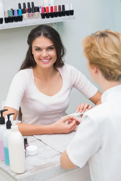 Nail technician giving manicure — Stock Photo, Image