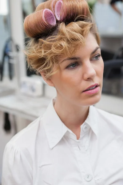 Customer sitting with curlers in hair — Stock Photo, Image