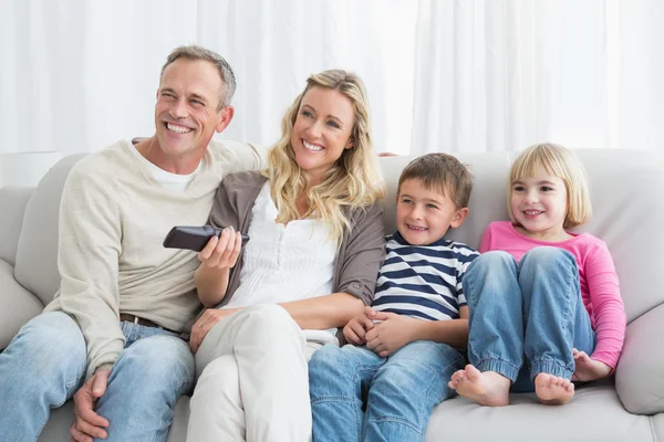 Family changing tv channels — Stock Photo, Image