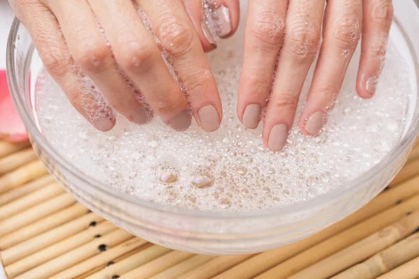 Customer washing nails — Stock Photo, Image