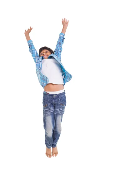 Boy jumping up and smiling — Stock Photo, Image