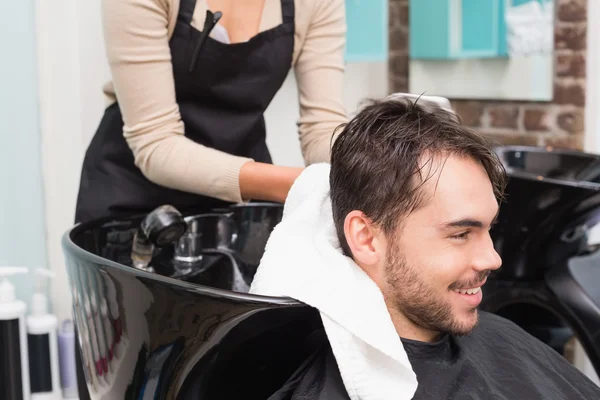 Hair stylist drying male hair — Stock Photo, Image