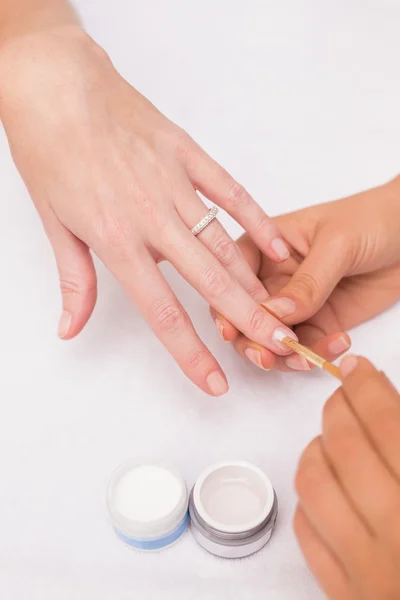 Nail technician giving manicure — Stock Photo, Image