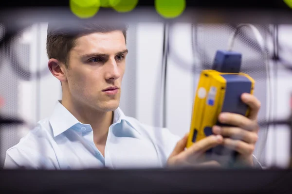 Technician using digital cable analyzer — Stock Photo, Image