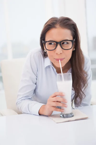 Businesswoman drinking milk — Stock Photo, Image