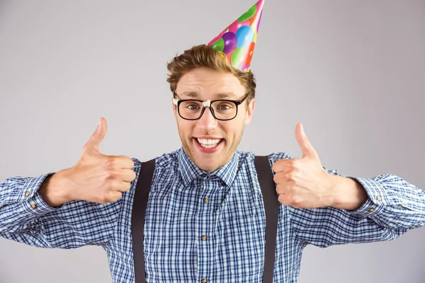 Hipster wearing party hat smiling at camera — Stock Photo, Image