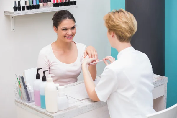 Nail technician giving manicure — Stock Photo, Image