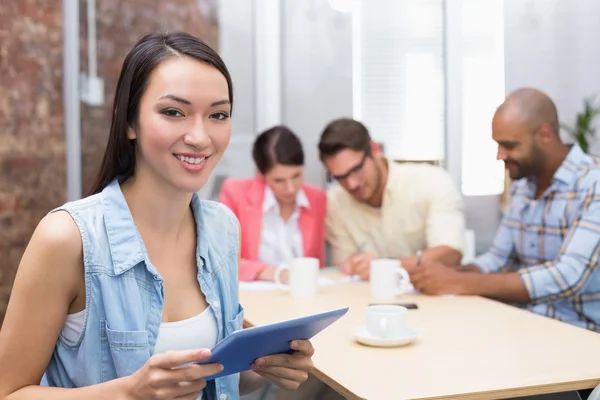 Businesswoman touching tablet computer — Stock Photo, Image