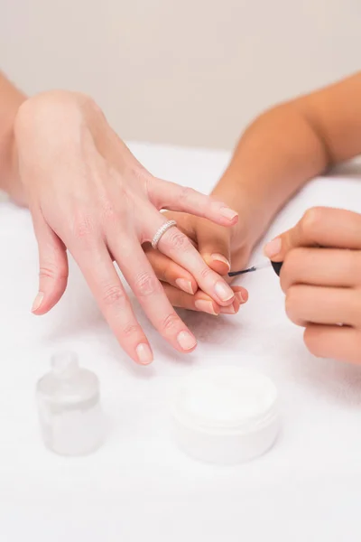 Nail technician giving manicure — Stock Photo, Image