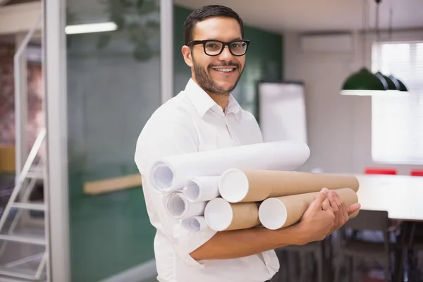 Architect holding blueprints — Stock Photo, Image