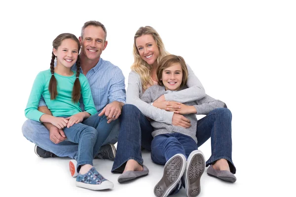 Familia sentada en el suelo — Foto de Stock