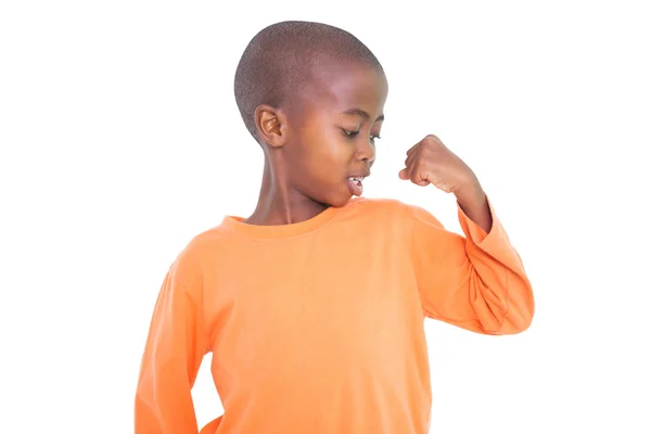 Boy flexing arm — Stock Photo, Image