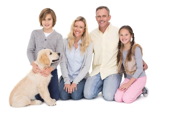 Family sitting together with dog — Stock Photo, Image