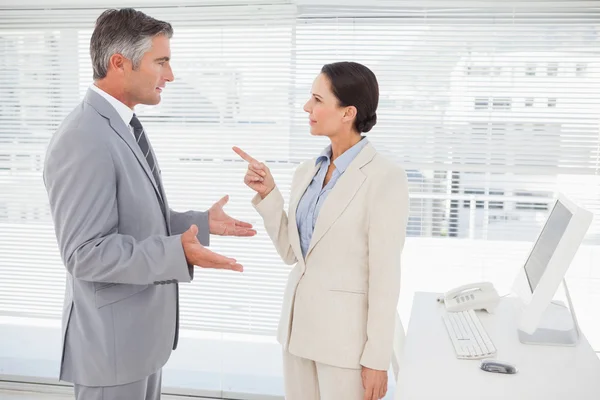 Businesswoman arguing with coworker Royalty Free Stock Photos